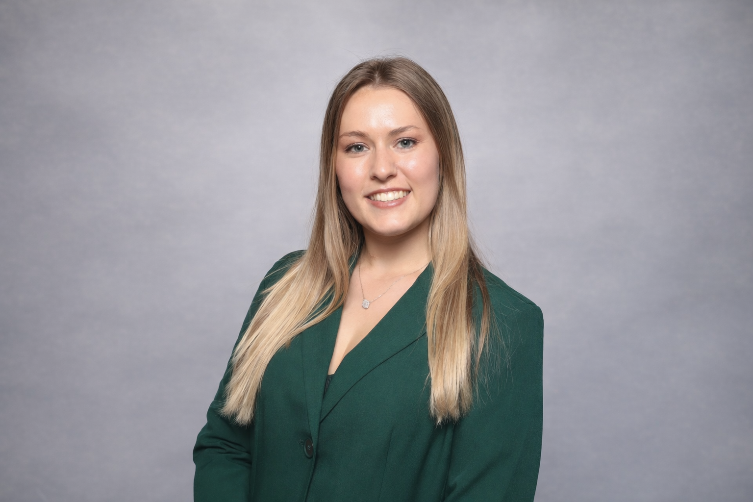 Professional portrait with confident smile.png